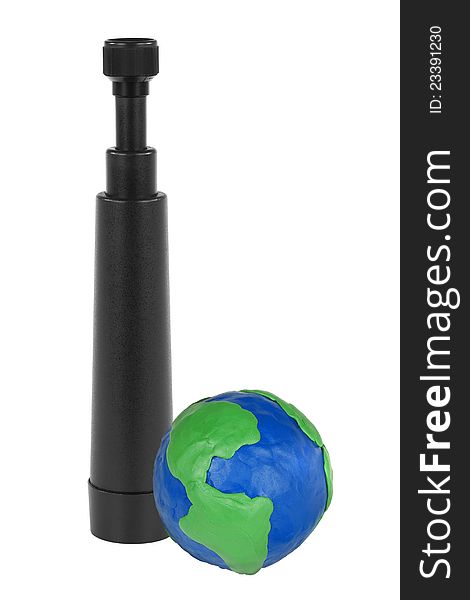 Black telescope and white plasticine Globe. Black telescope and white plasticine Globe