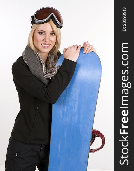 Snow Ready Woman Poses Next to Snow Board