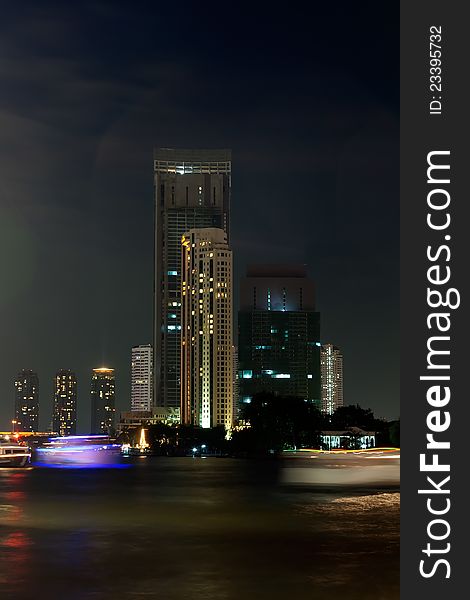 View of the Bangkok night across the river Chao Phraya