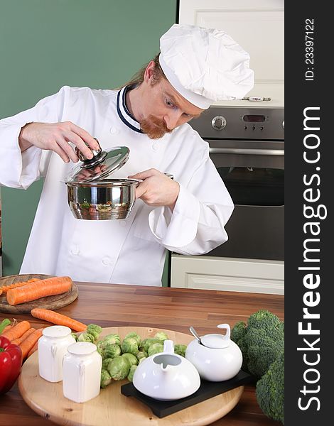 Funny young chef strange looking at pot