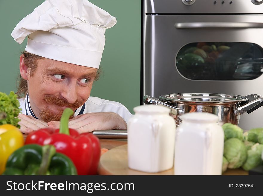 Young Chef Preparing Lunch In Kitchen