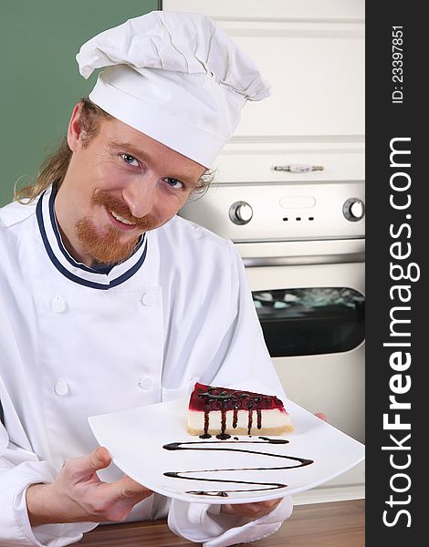 Young chef with piece of cake