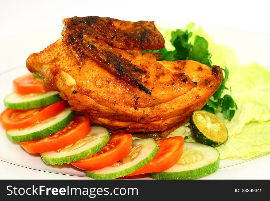 Roasted chicken with vegetables on white background. Roasted chicken with vegetables on white background