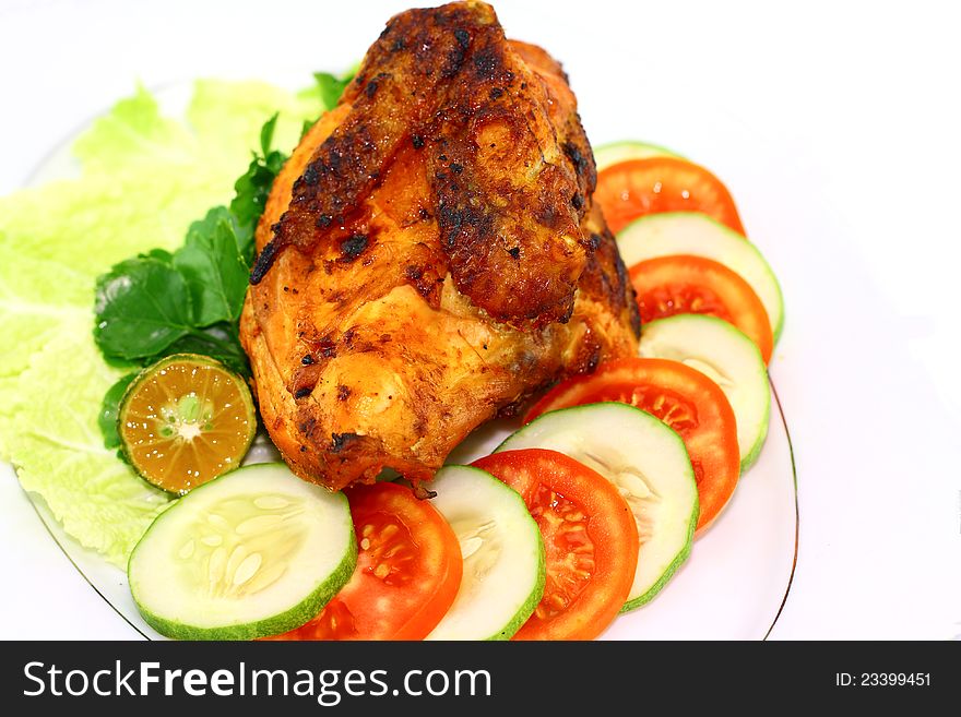 Roasted chicken with vegetables on white background. Roasted chicken with vegetables on white background