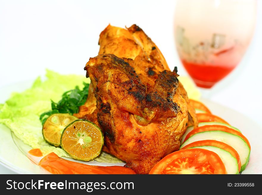 Roasted chicken with vegetables on white background. Roasted chicken with vegetables on white background