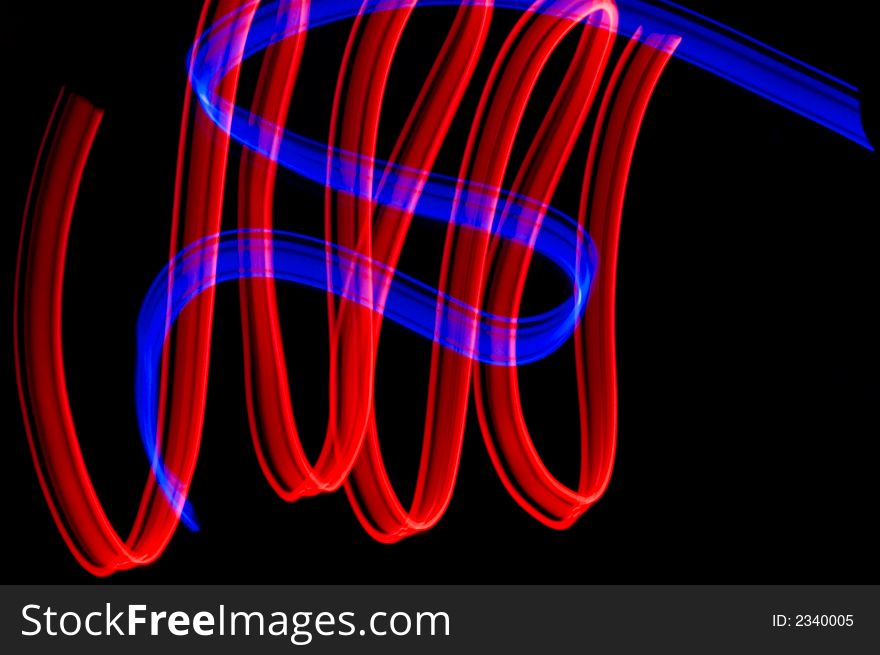 Some colrful LED lights in motion resembling ribbons. Some colrful LED lights in motion resembling ribbons