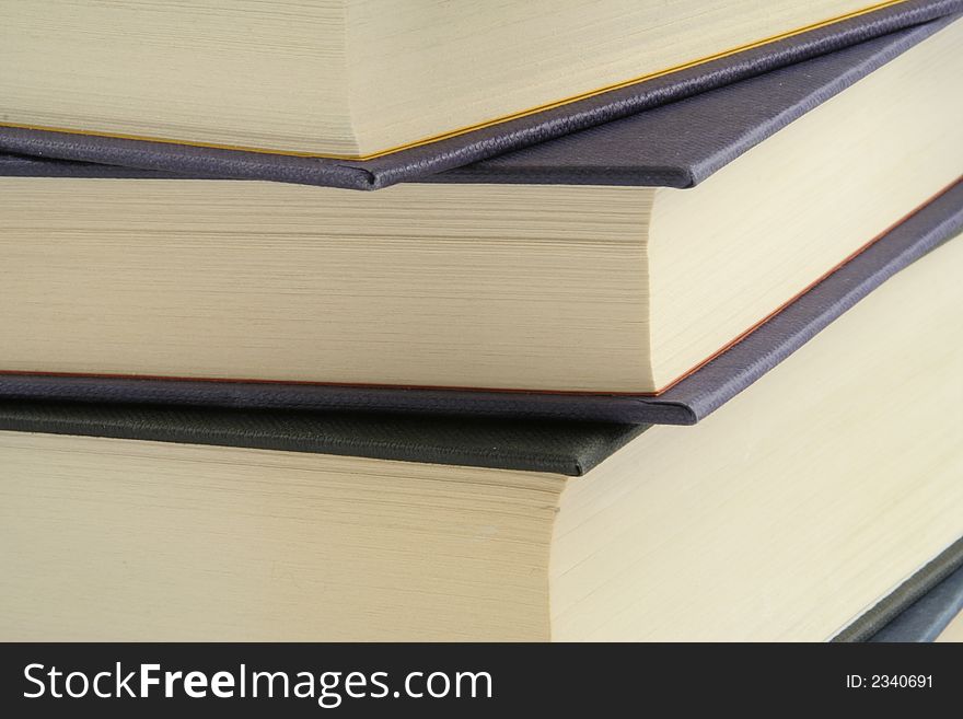 Stack of books against a white background