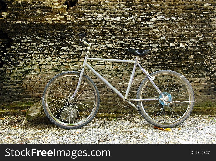 A bicycle against an old coral wall. A bicycle against an old coral wall.