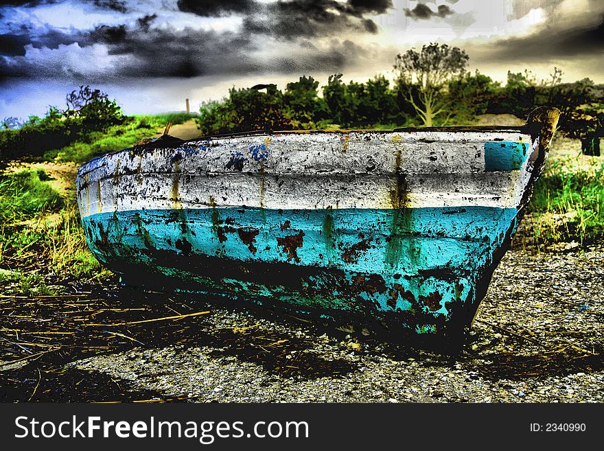 Green and White Sailing boat stranded at low tide in ocean at Vilanculos, Mozambique with artistic retouching. Green and White Sailing boat stranded at low tide in ocean at Vilanculos, Mozambique with artistic retouching