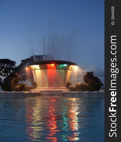 Bright Colourful fountain in a park at night