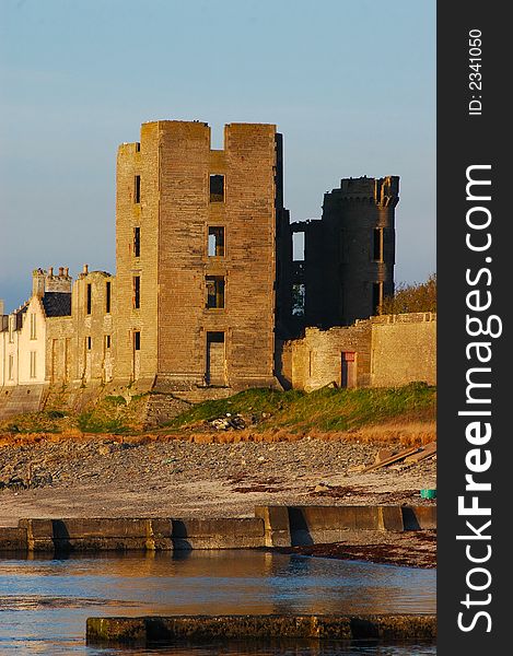 Thurso Castle, in Caithness, Scotland, in the golden rays of the evening sunshine. Where the river Thurso joins the Atlantic ocean on the northern coastline. Thurso Castle, in Caithness, Scotland, in the golden rays of the evening sunshine. Where the river Thurso joins the Atlantic ocean on the northern coastline.