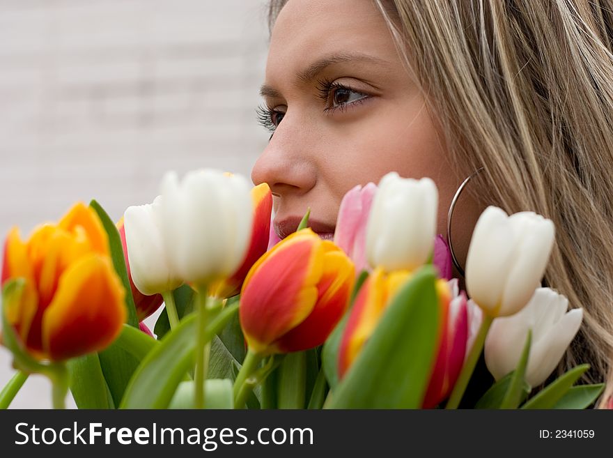 Girl With Bouquet Of Tulips