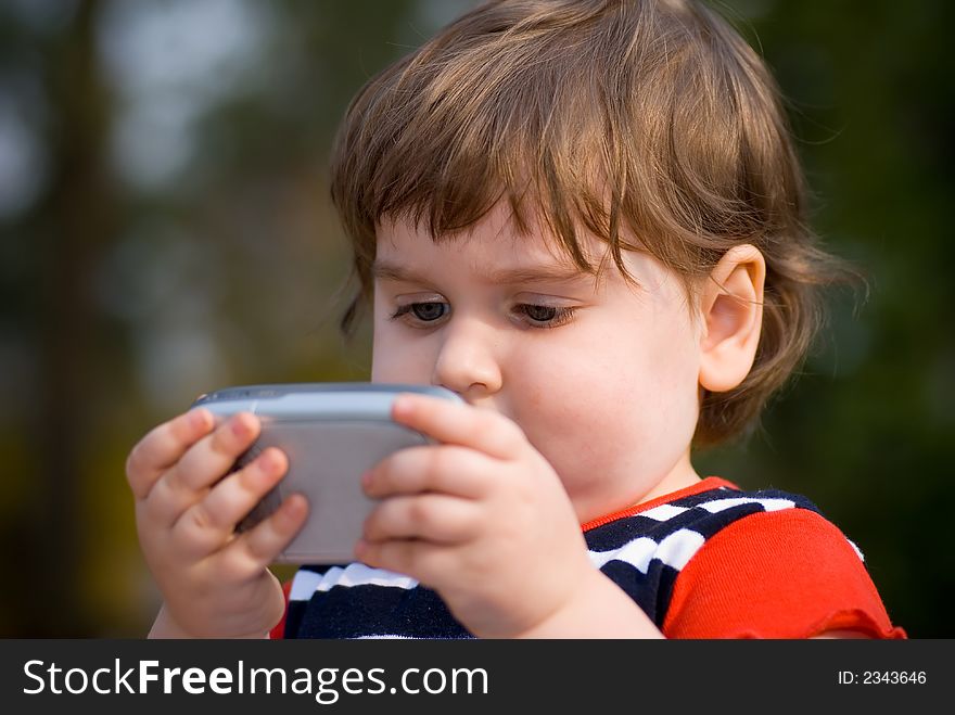 Small child playing on pocketpc. Small child playing on pocketpc
