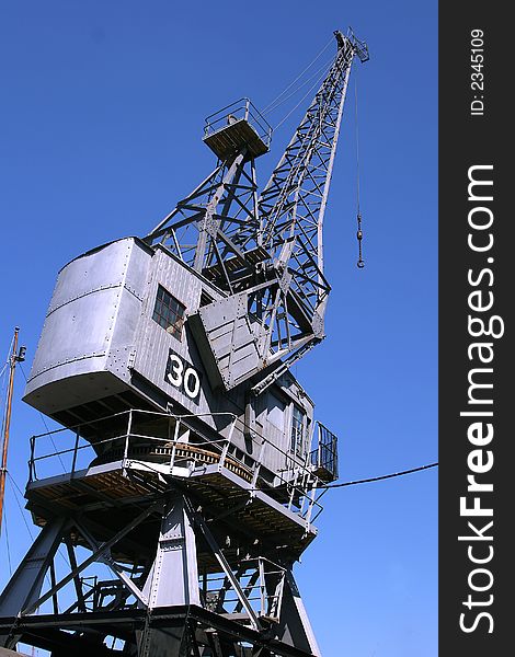 Tall dock crane, against a clear blue sky