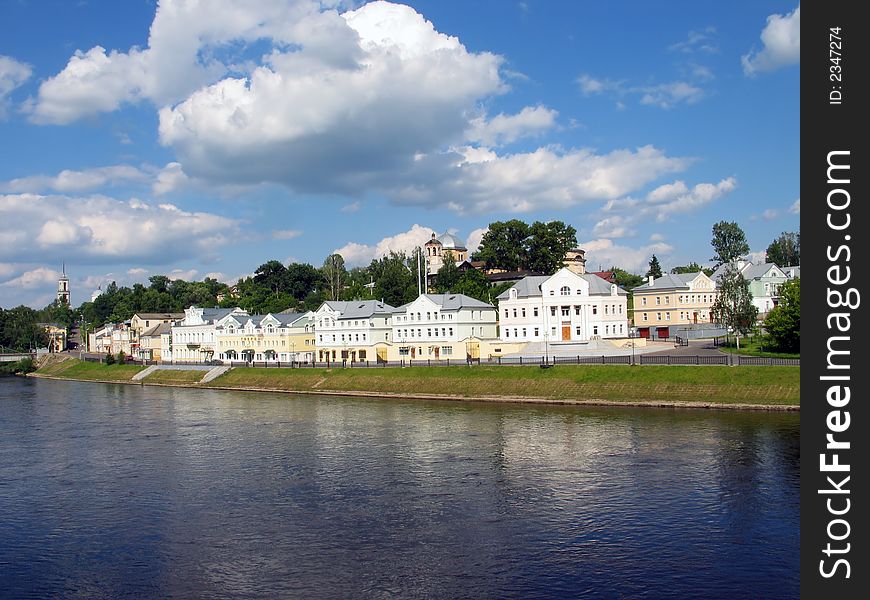 Summer view of office buildings on the riverside. (Torzhok. Tver region. Russia). Summer view of office buildings on the riverside. (Torzhok. Tver region. Russia).