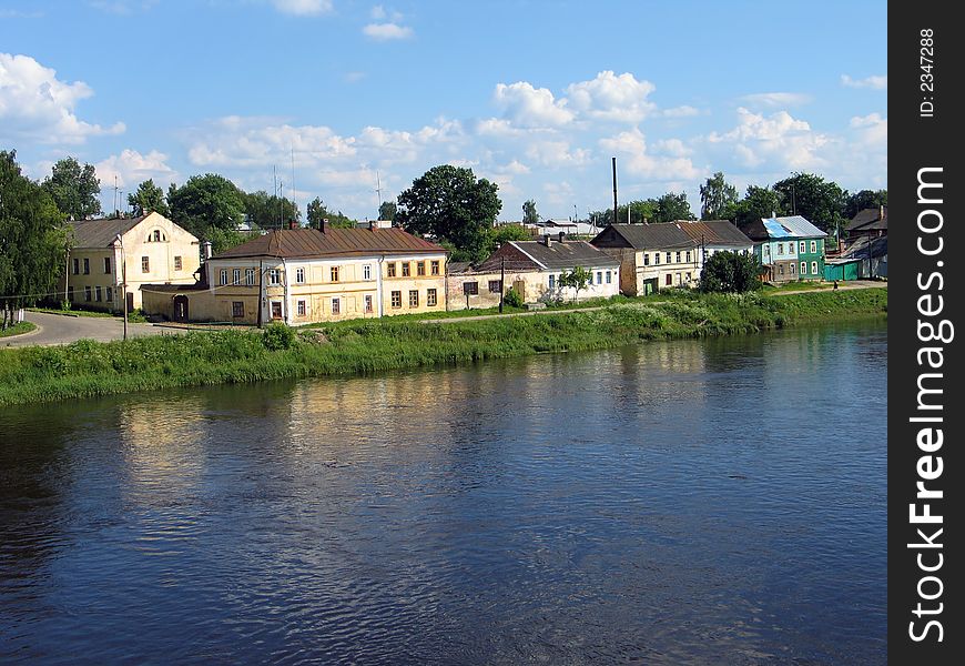 Houses on the riverside in small town. (Torzhok, Tver region, Russia). Houses on the riverside in small town. (Torzhok, Tver region, Russia)
