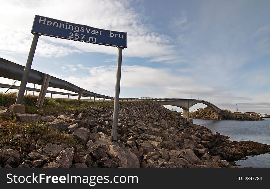 Signage: Henningsvaer bru, Norway landscape with bridge and sign