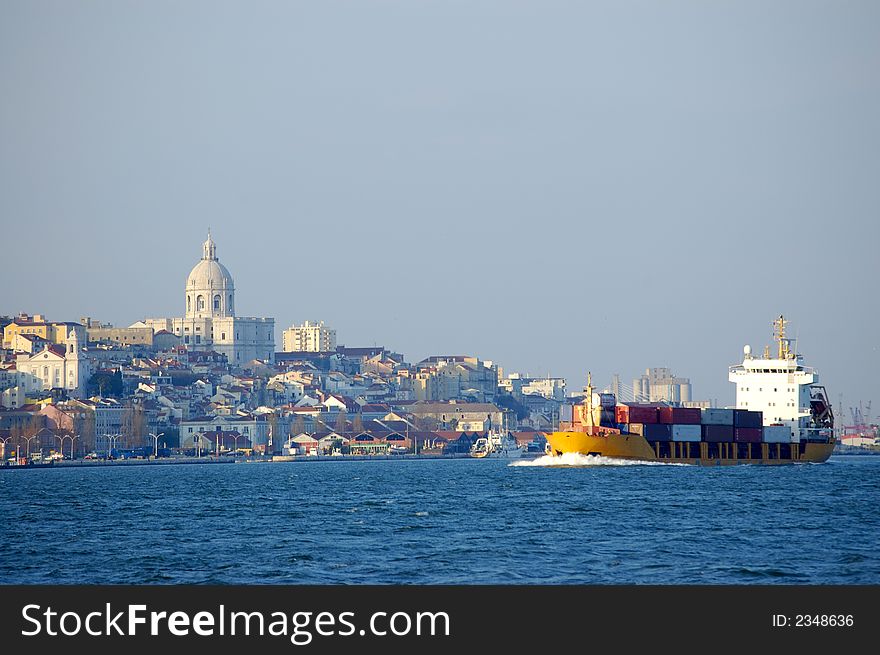 Cargo boat arriving to the dock of lisbon