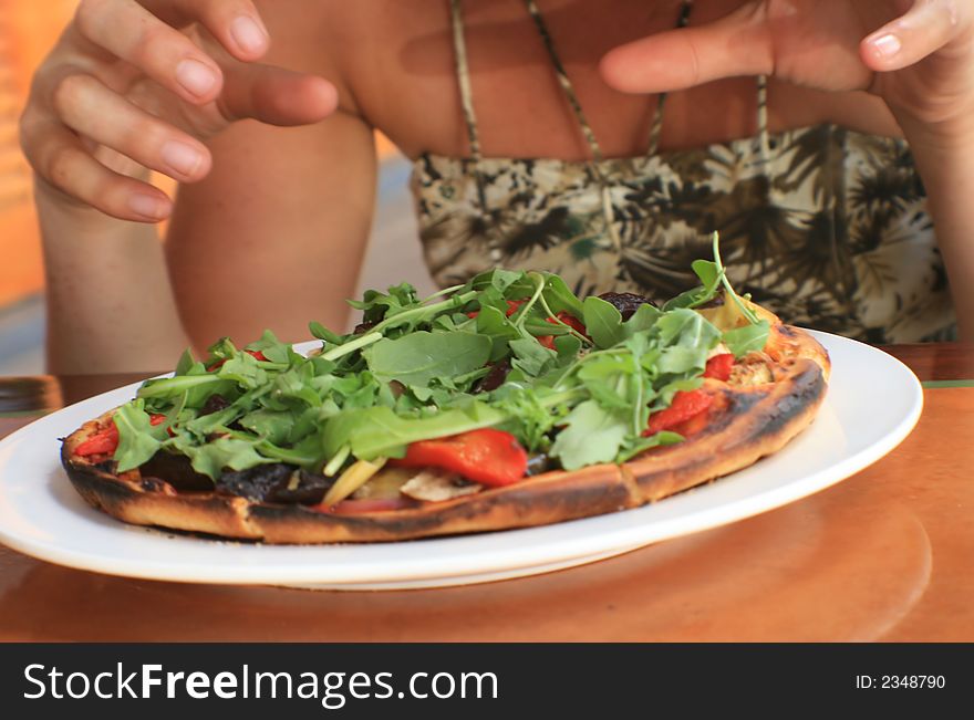 Pizza obsession - hands reaching out to eat it all at once!