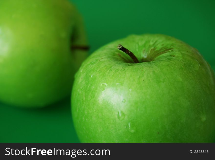 Healthy diet, Green apple with green background. Healthy diet, Green apple with green background