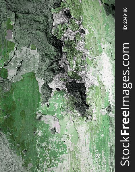 Grunge wall with peeling paint in green