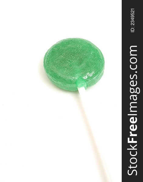 Picture of a green lollipop on white