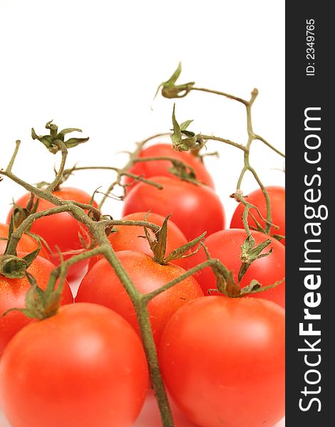 Picture of cherry tomatoes on vine vertical