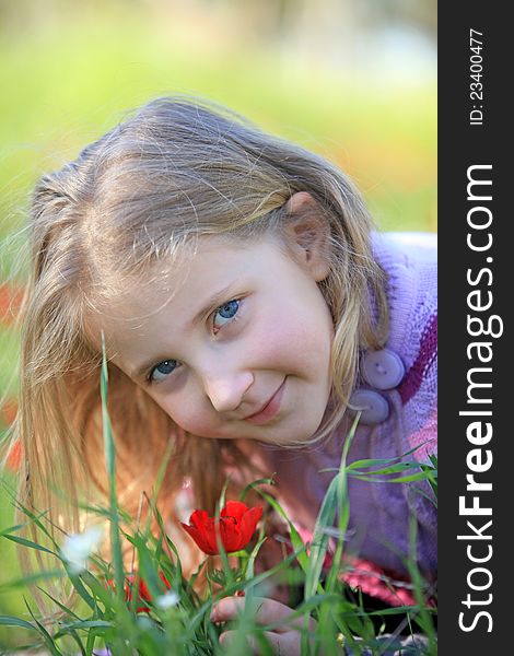 Portrait of blond child outside in nature