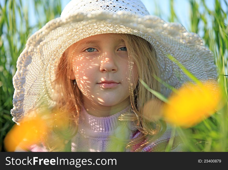 Portrait of a girl in a cap summer