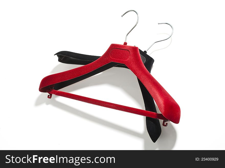 Clothes hangers different color on white background