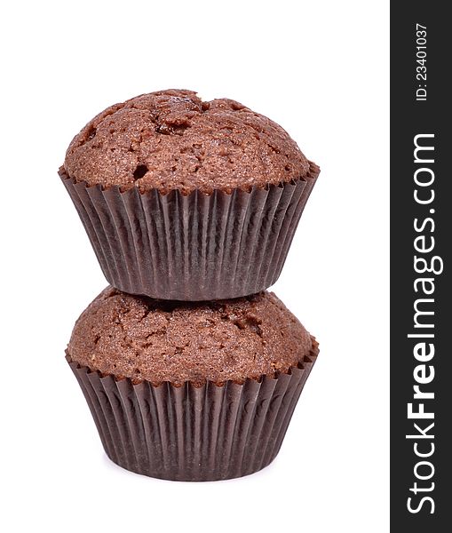 Two delicious  fresh baked chocolate muffins cupcakes muffin isolated on a white background