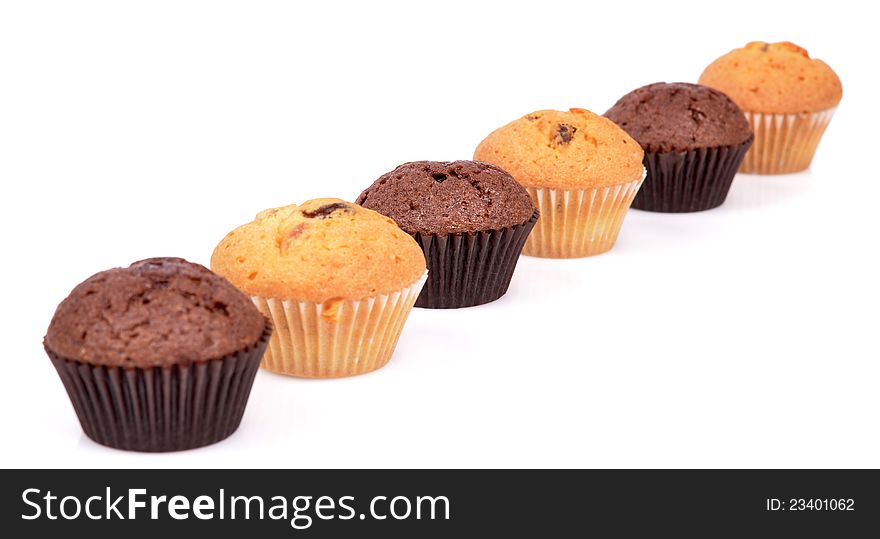 Six delicious  fresh baked chocolate muffins cupcakes muffin isolated on a white background