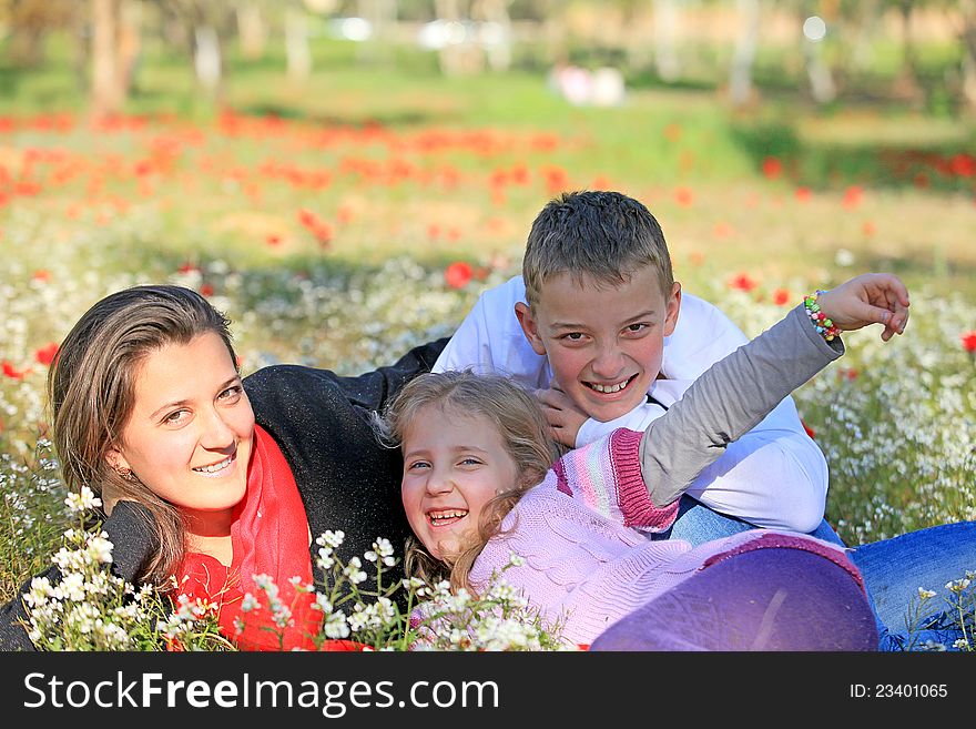 Mom with son and daughter in the park fooled