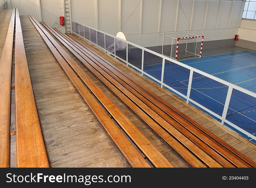 Wooden grandstands all in length in a gymnasium