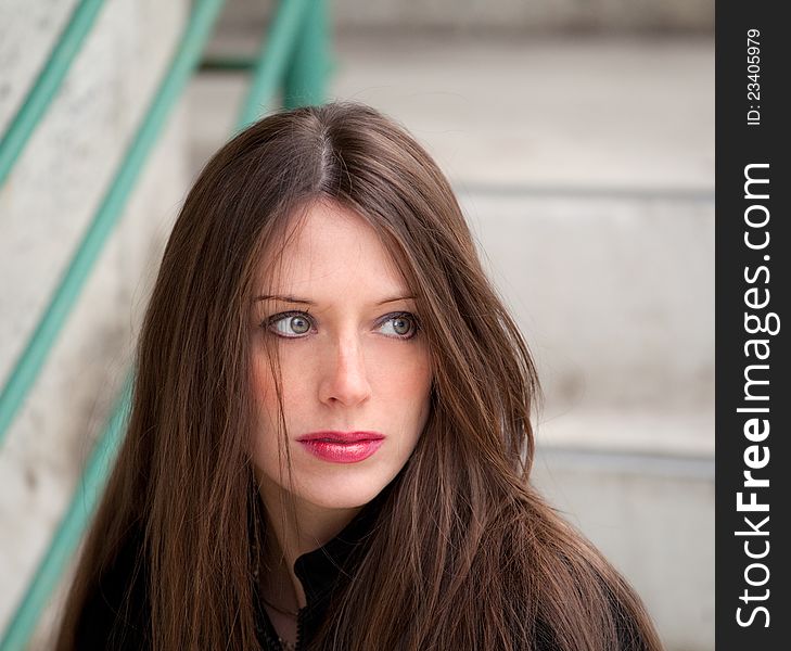 A portrait of a beautiful woman in an urban setting. A portrait of a beautiful woman in an urban setting