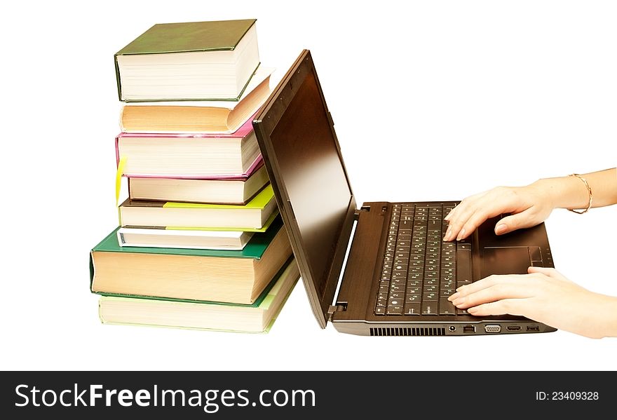 The laptop and books, encyclopedias on a white background