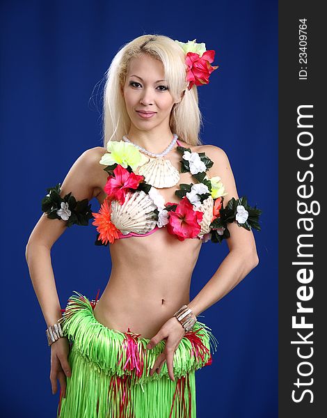 Girl dances exotic dance.Dark blue background.