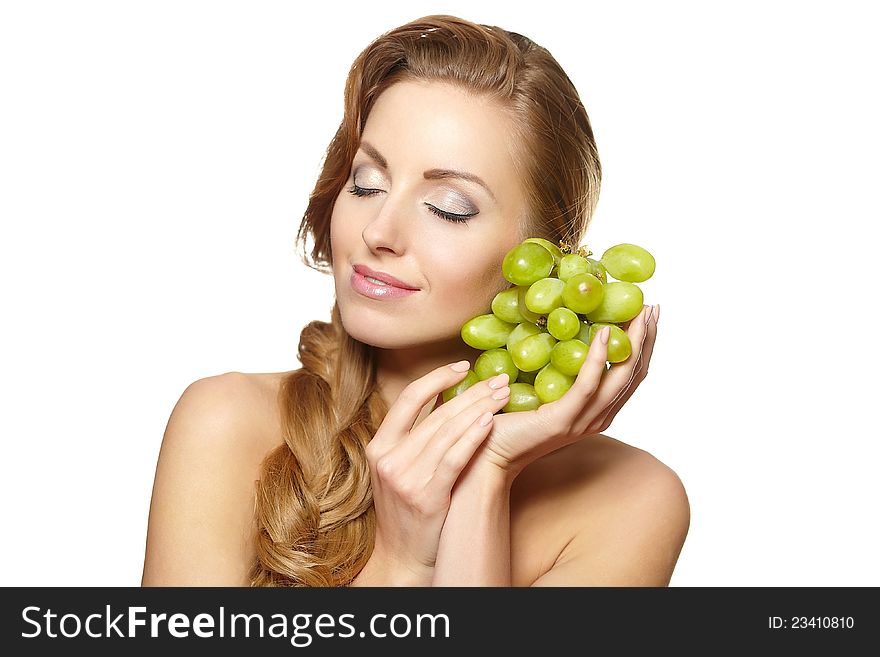 Smiling beautiful  woman holding a bunch of grape