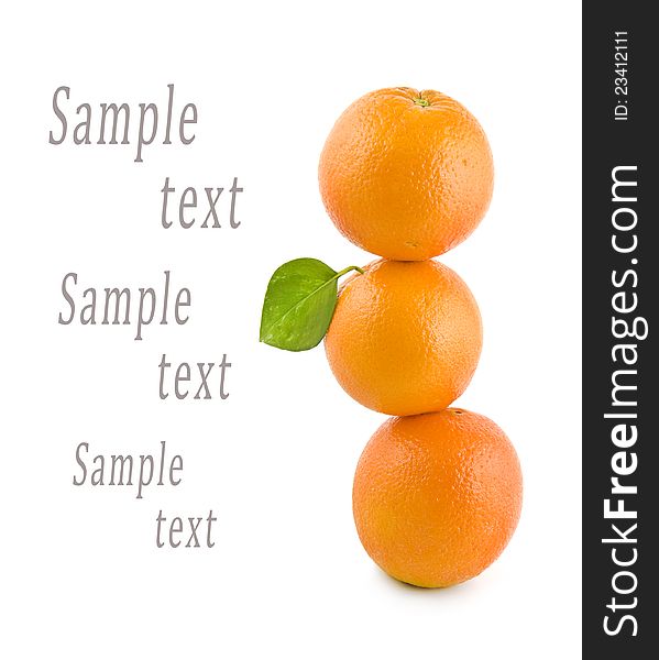 Three oranges stand on each other on a white background