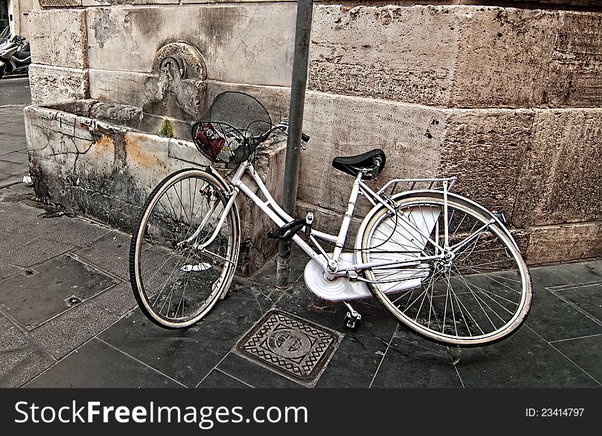 A Lone Bicycle Thrown On The Street.
