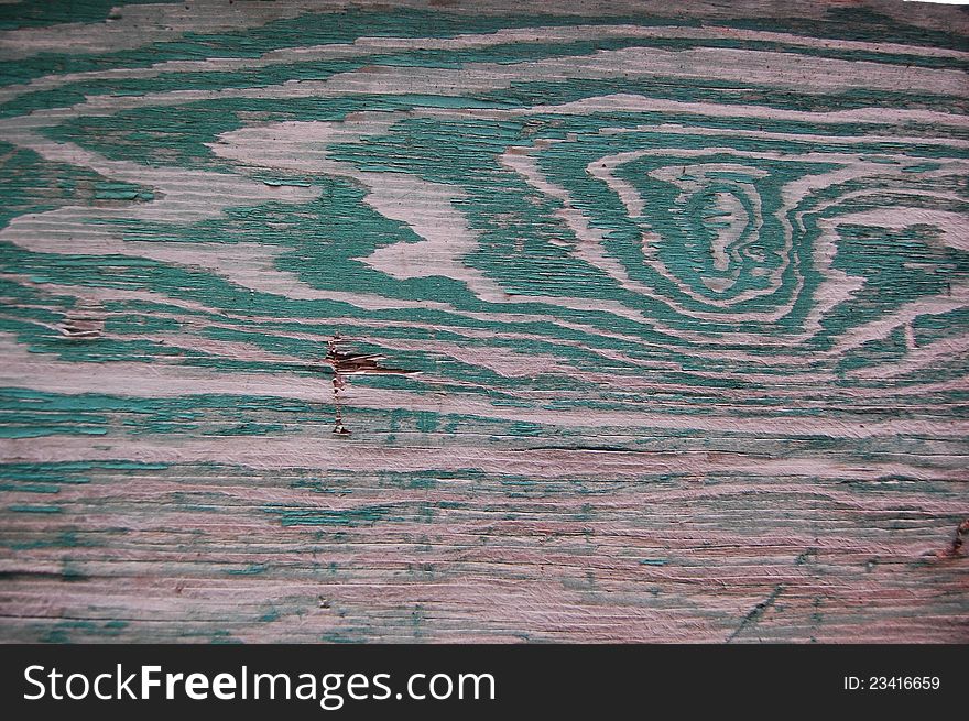 Wooden texture on the wall with traces of green paint. Wooden texture on the wall with traces of green paint