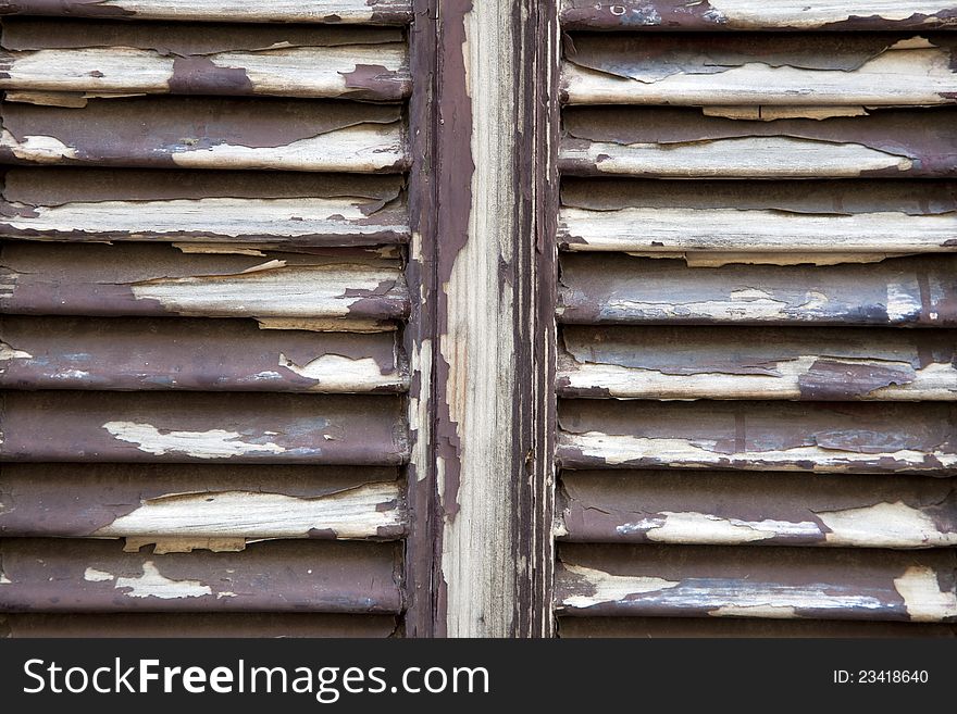 Close up of old shutters with peeling paint. Close up of old shutters with peeling paint.