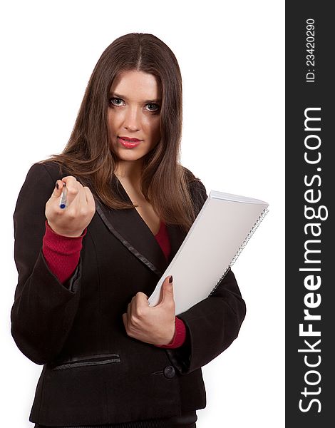 The girl with a notebook and pen on a white background. The girl with a notebook and pen on a white background