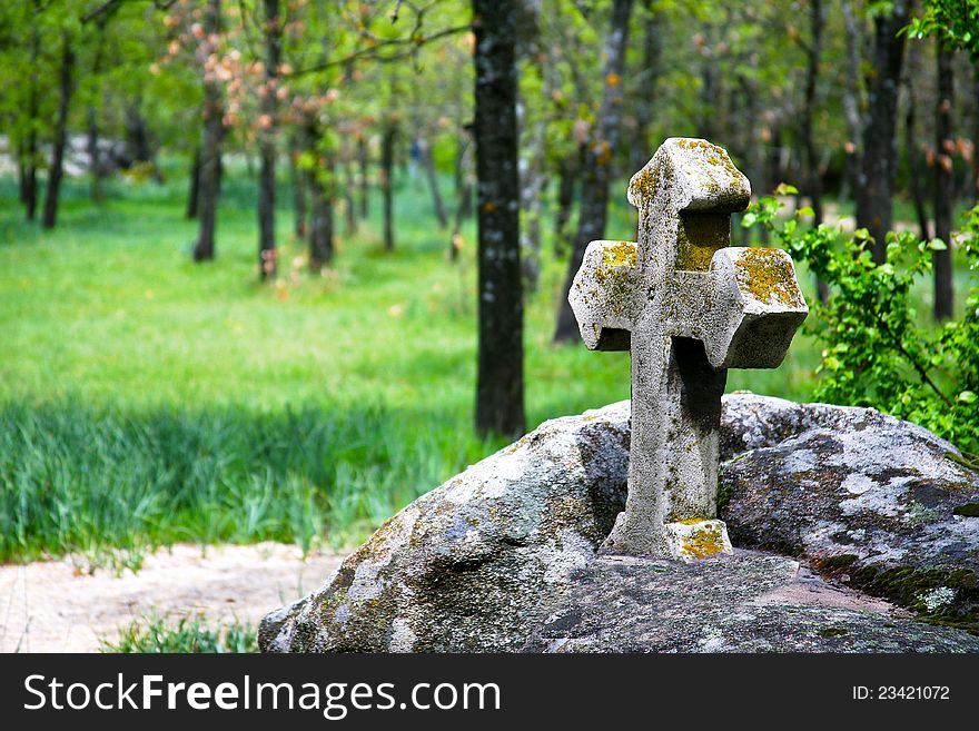 Is a cross built on rocks in the woods. Is a cross built on rocks in the woods