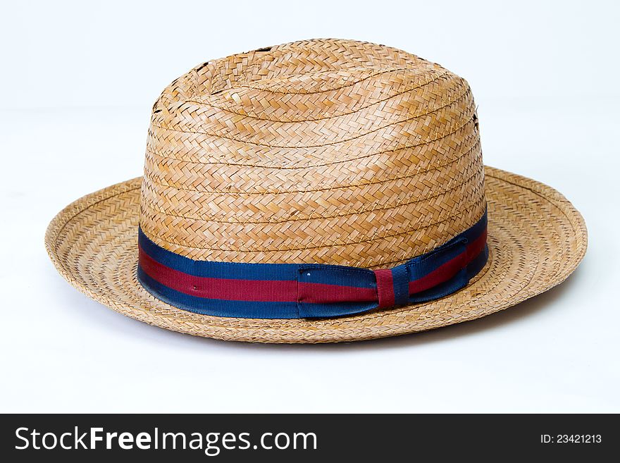 A woven straw hat . A woven straw hat .