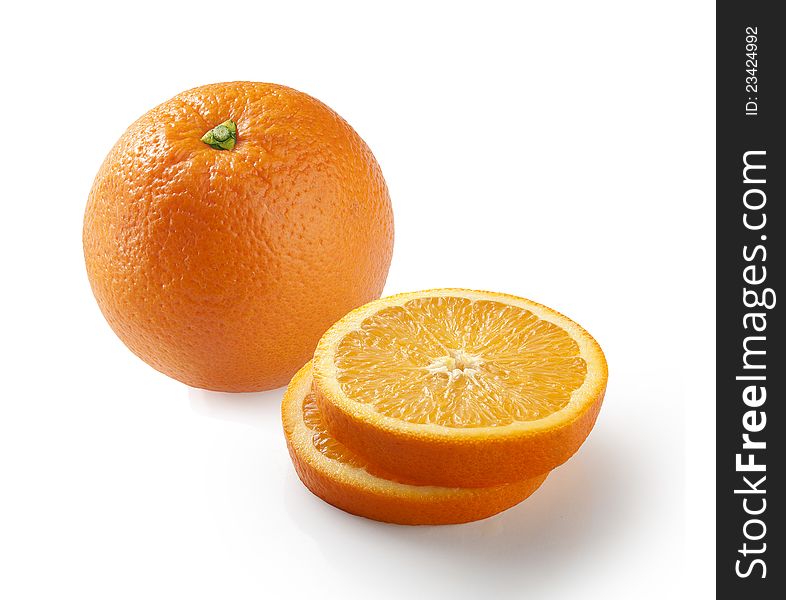 Whole and pieces of orange on the white. Whole and pieces of orange on the white