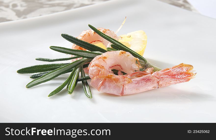 Two coldwater shrimp with lemon and rosemary. Two coldwater shrimp with lemon and rosemary