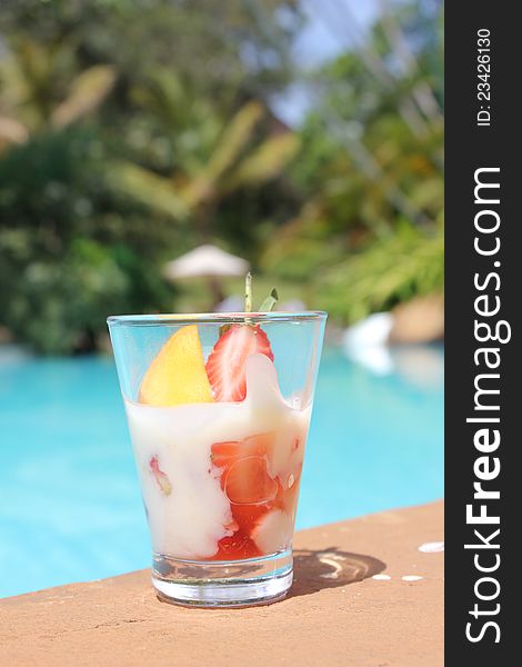 Exotic cocktail by tropical swimming pool in Nairobi, Kenya
