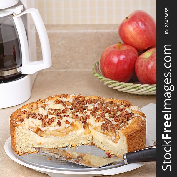 Apple cream cheese coffee cake on kitchen counter. Apple cream cheese coffee cake on kitchen counter