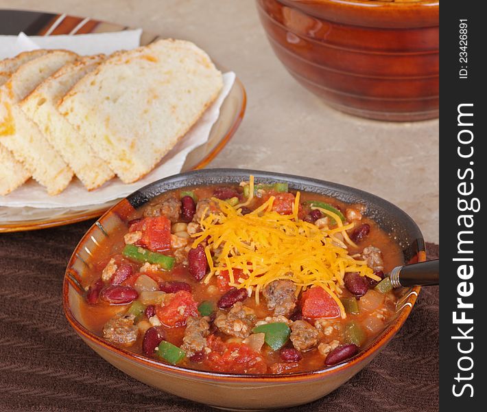 Bowl of chili with beans and chedar cheese. Bowl of chili with beans and chedar cheese